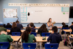 teacher in front of full classroom