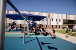 student on swings