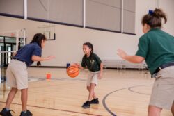 students playing basketball