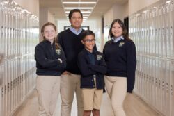 four students in hallway
